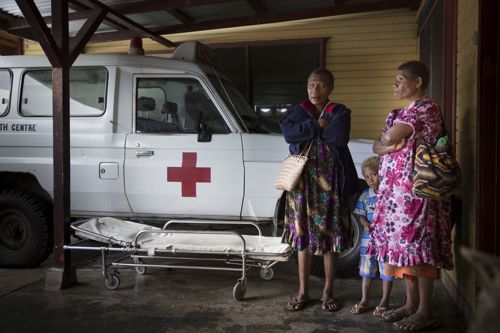 Woman next to ambulance